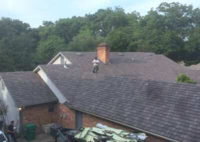 Contractor Doing Asphalt Shingles Roofing Services
